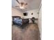 Comfortable bedroom with a ceiling fan, TV, and keyboard at 6846 Wilson Hammock Ave, Groveland, FL 34736