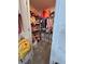 Walk-in closet with ample storage for clothes, toys, and accessories at 6846 Wilson Hammock Ave, Groveland, FL 34736