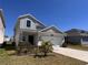Attractive two-story home with a two-car garage and a neatly landscaped front yard at 6846 Wilson Hammock Ave, Groveland, FL 34736