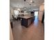 Spacious kitchen with central island offering stainless steel appliances, and open floor plan at 6846 Wilson Hammock Ave, Groveland, FL 34736