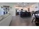 Modern kitchen with stainless steel appliances, island with barstool seating at 6846 Wilson Hammock Ave, Groveland, FL 34736