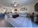 Spacious living room with a neutral color palette and abundant natural light at 6846 Wilson Hammock Ave, Groveland, FL 34736