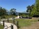 Scenic community park with picnic tables, benches, and a tranquil lakeside view at 6846 Wilson Hammock Ave, Groveland, FL 34736