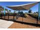 Fenced playground featuring play equipment and a shaded area for children at 6846 Wilson Hammock Ave, Groveland, FL 34736