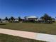 Community playground shaded by a pavilion, offering a safe and fun area for  at 6846 Wilson Hammock Ave, Groveland, FL 34736