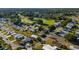 Community aerial view featuring lush golf course, waterways, and well-maintained landscaping at 728 Tangerine Dr, The Villages, FL 32159