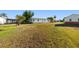 Expansive backyard featuring well-maintained grass, perfect for outdoor activities and gardening at 728 Tangerine Dr, The Villages, FL 32159