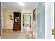 Inviting foyer with tile flooring, mirrored closet, and a glimpse of the outdoor scenery at 728 Tangerine Dr, The Villages, FL 32159