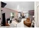 Open-concept living area featuring two recliners, a ceiling fan, and a desk area at 728 Tangerine Dr, The Villages, FL 32159