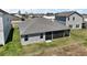 Backyard view of home with screened in patio in a residential community at 7669 Chastain Cir, Middleton, FL 34762