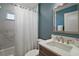 Bathroom features tiled walls, shower and tub combination, and vanity sink at 7669 Chastain Cir, Middleton, FL 34762