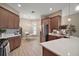 Bright kitchen features stainless steel appliances, modern cabinets, light countertops and breakfast area at 7669 Chastain Cir, Middleton, FL 34762
