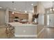 Stylish kitchen featuring stainless steel appliances, a large island, and ample counter space for food preparation at 7669 Chastain Cir, Middleton, FL 34762