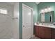 Main bathroom features a walk-in shower, vanity with sink and storage space at 7669 Chastain Cir, Middleton, FL 34762