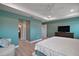 Spacious main bedroom with sitting area and view into the main bathroom at 7669 Chastain Cir, Middleton, FL 34762