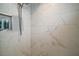 Shower in the main bathroom with white tile and toiletry niche at 7669 Chastain Cir, Middleton, FL 34762