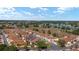Scenic aerial view of a vibrant residential community, showcasing well-maintained homes and serene lake views at 850 Oviedo Rd, Lady Lake, FL 32159