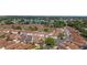 Overhead view of a residential neighborhood with meticulously kept homes, lush landscaping, and a picturesque lake at 850 Oviedo Rd, Lady Lake, FL 32159