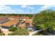 Aerial view of residential home featuring solar panels and lush green landscaping, creating a cozy environment at 850 Oviedo Rd, Lady Lake, FL 32159
