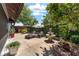 Outdoor patio area with a fountain, patio furniture and garden areas for relaxation and entertainment at 850 Oviedo Rd, Lady Lake, FL 32159