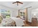 Bright bedroom with a sliding door to a sunroom at 850 Oviedo Rd, Lady Lake, FL 32159