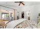 Bright bedroom with a sliding door to a sunroom, closet, and bathroom at 850 Oviedo Rd, Lady Lake, FL 32159