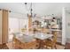 Stylish dining area flowing into the kitchen, with a table and views of the outdoor patio at 850 Oviedo Rd, Lady Lake, FL 32159