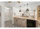 Bright kitchen featuring custom tile flooring, granite countertops, and a breakfast bar overlooking the dining room at 850 Oviedo Rd, Lady Lake, FL 32159
