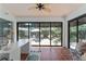 Cozy sunroom with large windows overlooking a fountain at 850 Oviedo Rd, Lady Lake, FL 32159