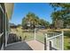 Backyard from patio area featuring lush lawn, landscaping, and privacy at 8715 Se 176Th Lowndes Pl, The Villages, FL 32162