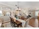 Spacious dining room features an open plan with views to the kitchen, living room and entryway at 8715 Se 176Th Lowndes Pl, The Villages, FL 32162