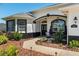 Beautiful home with meticulously landscaped front yard, stone accents, and a charming walkway leading to the inviting entrance at 8715 Se 176Th Lowndes Pl, The Villages, FL 32162