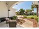 Inviting front porch with comfortable seating and a view of the beautifully landscaped yard at 8715 Se 176Th Lowndes Pl, The Villages, FL 32162