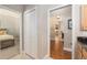 Hallway shows access to a bedroom on the left and the dining area on the right at 8715 Se 176Th Lowndes Pl, The Villages, FL 32162