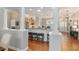 Bright kitchen has an open floor plan view to the dining room and entryway with seating at the counter at 8715 Se 176Th Lowndes Pl, The Villages, FL 32162