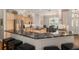 Kitchen with black granite countertops, stainless steel appliances, and natural wood cabinets at 8715 Se 176Th Lowndes Pl, The Villages, FL 32162