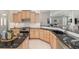 Spacious kitchen featuring granite countertops and stainless steel appliances at 8715 Se 176Th Lowndes Pl, The Villages, FL 32162