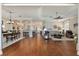 An open-concept layout showcases a dining area, living room, and entry to other rooms at 8715 Se 176Th Lowndes Pl, The Villages, FL 32162