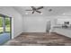 Bright, open living space featuring luxury vinyl plank floors, neutral walls, and a sliding glass door at 8742 Se 158Th Pl, Summerfield, FL 34491