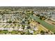 An aerial view of the community highlights the lush landscaping, and convenient access to the neighborhood golf course at 929 Eastmont Ct, The Villages, FL 32162