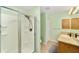 Bathroom features a shower, neutral color walls, vanity with sink, and essential fixtures at 929 Eastmont Ct, The Villages, FL 32162