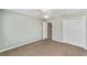 Neutral bedroom with carpet, ceiling fan, and closet with white doors at 929 Eastmont Ct, The Villages, FL 32162