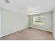 Neutral bedroom featuring carpet, ceiling fan, and a window with natural light at 929 Eastmont Ct, The Villages, FL 32162