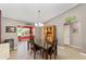 Inviting dining area with a telescope view, seamlessly connected to the living space at 929 Eastmont Ct, The Villages, FL 32162