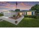Charming single-story home with lush lawn, well-manicured landscaping and inviting front porch at 929 Eastmont Ct, The Villages, FL 32162