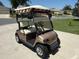 Golf cart located near a neighborhood street is ideal for transportation around the community at 929 Eastmont Ct, The Villages, FL 32162