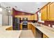 Well-equipped kitchen boasting stainless steel appliances, ample cabinet space, and a functional island at 929 Eastmont Ct, The Villages, FL 32162