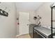 Functional laundry room with modern washer and dryer, door, and convenient storage solutions at 929 Eastmont Ct, The Villages, FL 32162
