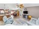 Bright living space featuring tile flooring, modern furnishings and a view of the dining area at 929 Eastmont Ct, The Villages, FL 32162