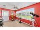 Bright living room featuring large window, desk, and telescope for enjoying outdoor views at 929 Eastmont Ct, The Villages, FL 32162